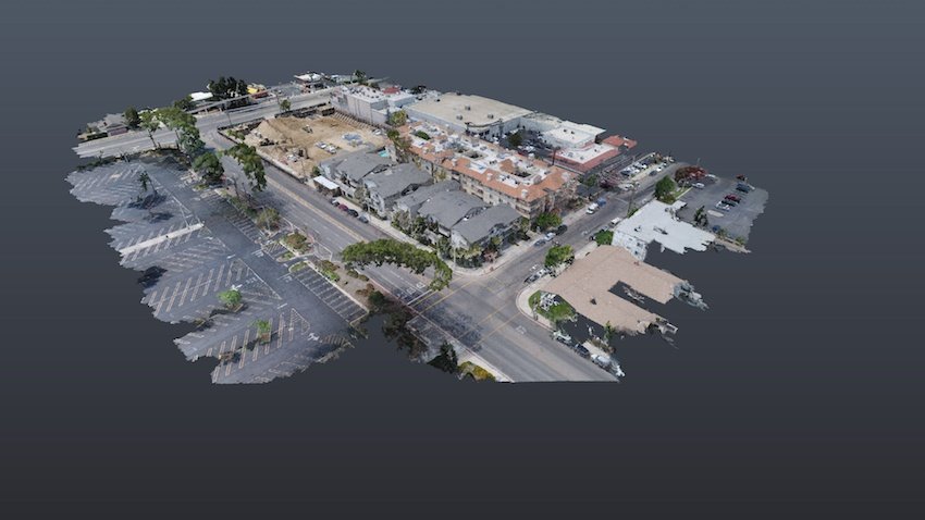 Drone scan of a multi-story building and surrounding streets